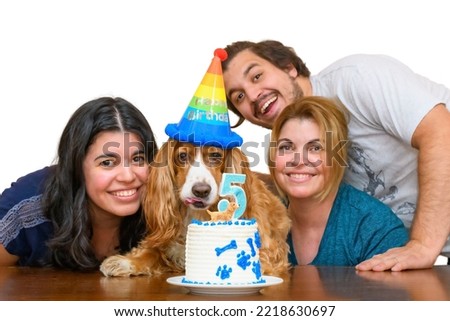 Family celebrating their dog pet 5th anniversary