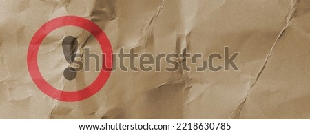 text with exclamation mark on paper background Royalty-Free Stock Photo #2218630785