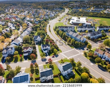Aerial view of upscale residential area, gated community street real estate with single family homes. Autumn sunny day. Royalty-Free Stock Photo #2218685999