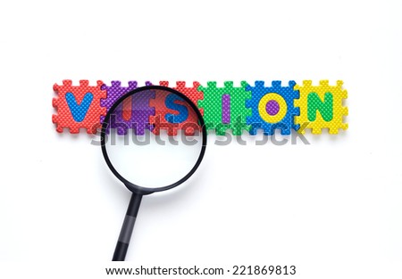 Magnifying glass on the colorful text puzzle, Vision white background