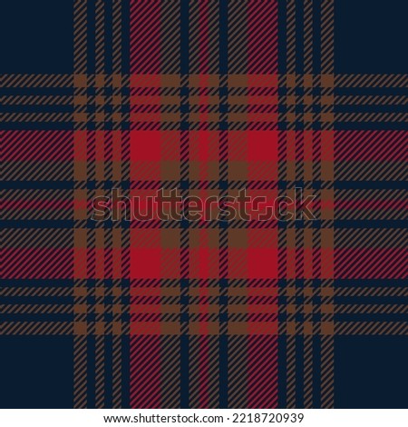 Red, brown and blue tartan plaid. Scottish pattern fabric swatch close-up. 