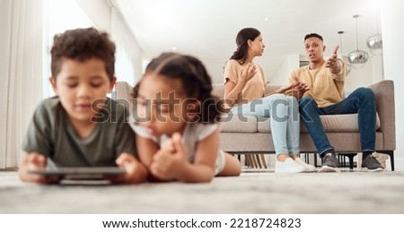 Mother, father and disagreement on living room sofa while children are playing with tablet on the floor at home. Mama and dad fighting, argue or conflict in difficult situation on couch in dispute Royalty-Free Stock Photo #2218724823