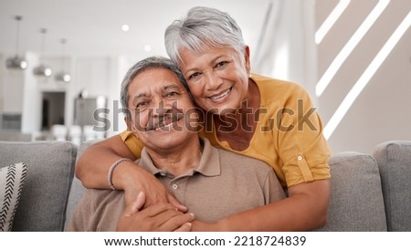 Portrait of elderly love, grandparents smile on sofa and old couple relax at home in happy retirement. Senior man, grandmother on couch and smile in living room getting hug from retired wife on couch