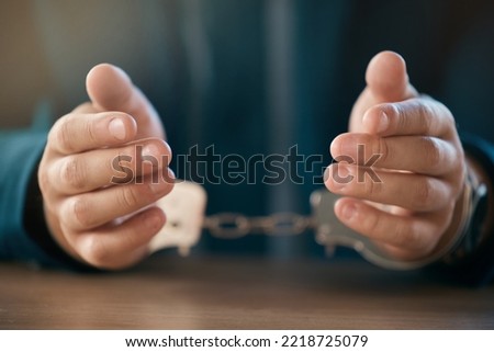 Business man, handcuffs hands and prisoner lock in jail, fraud and corruption scam, law and criminal money laundering. Crime, thief and penalty of arrested politician chain shackles for interrogation Royalty-Free Stock Photo #2218725079