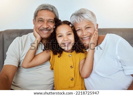 Family, happy and girl on a home living room sofa with grandparents love and care together. Portrait of senior people and a child with happiness smiling on a house lounge couch spending quality time Royalty-Free Stock Photo #2218725947