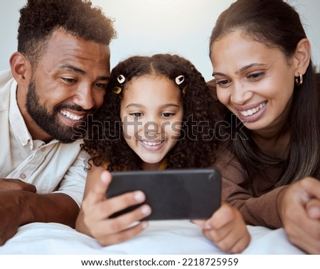 Black family, phone and child on bed for video, smile or happy for streaming, cartoon or movie. Mom, dad and kid with smartphone in bedroom to game, internet or watching to relax, happiness or play
