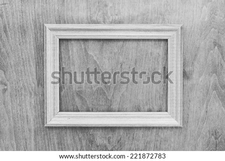 blank photo frame on old wooden gray wall