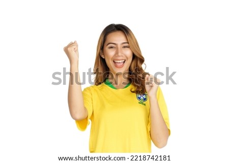 Brazilian supporter brazilian asian woman fan celebrating on soccer or football match isolated on white background