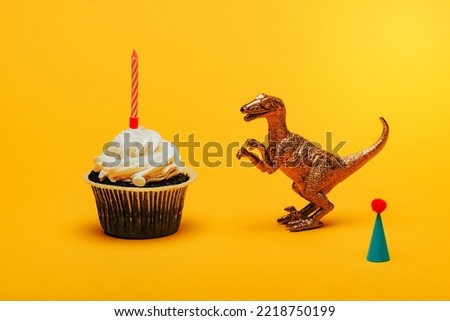 toy dinosaur party cap cupcake