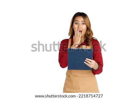 Coffee shop SME owner excited brunette asian woman wearing sweater and apron isolated on white background, Holding clipboard