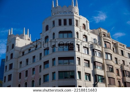 facades of old residential buildings. Windows, balconies, stone, brick, concrete.