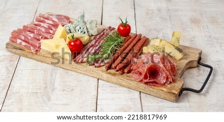 Appetizers table with italian antipasti snacks, tapas set, cheese and meat variety board. Top view. Royalty-Free Stock Photo #2218817969