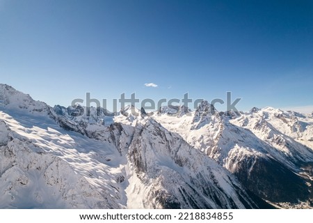 Snowy slopes of high mountains 