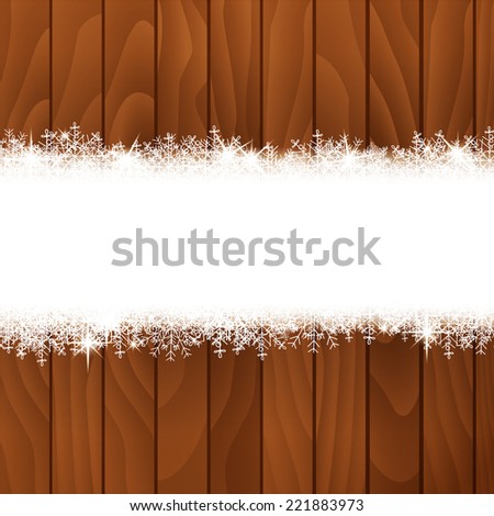 Snowflakes on wooden background.