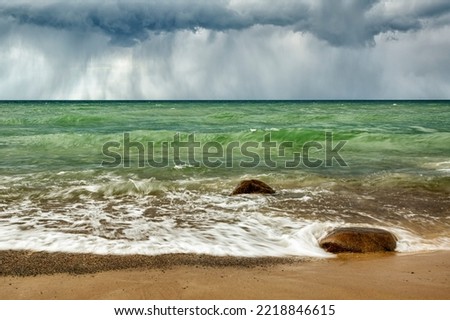 USA, Michigan, Upper Peninsula, rain clouds over Pictured Rocks National Lakeshore