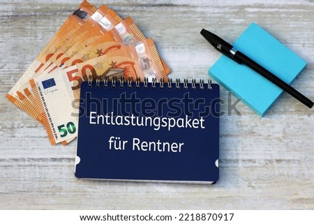 Notepad with the German text  Entlastungspaket für Rentner, German aid program during the energy crisis.
Entlastungspaket für Rentner translates to relief package for pensioners. Royalty-Free Stock Photo #2218870917