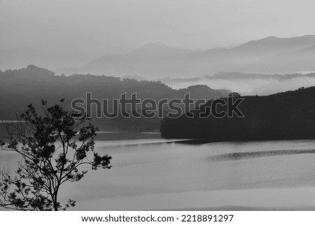 Tranquil and beautiful reservoir lake black and white landscape picture