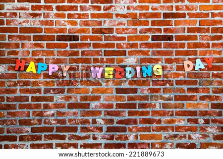 Inscription Happy Wedding Day on brick wall