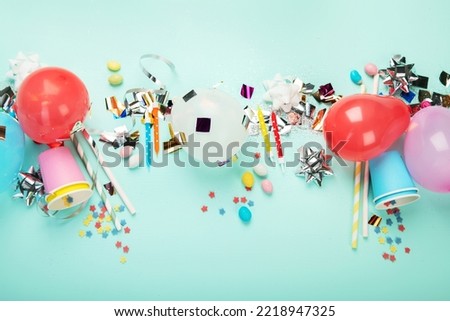 Carnival, festival or birthday holiday balloons blue background. Top view, flat lay with copy space