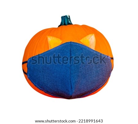 Halloween Orange Pumpkin with face mask isolated on white background.