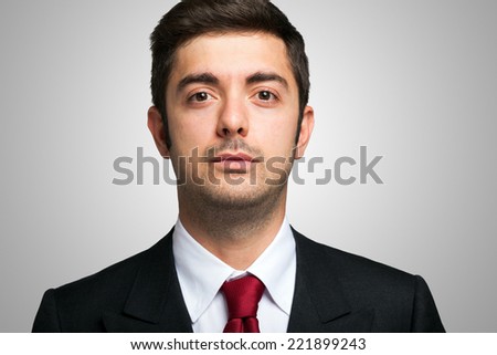 Closeup portrait of a young serious businessman