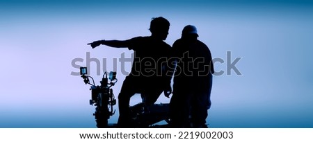 Video or film production studio used in shooting videography or photography and photo sets. Professional movie camera and film crew team making film scenes for cinema TV or online advertising works. Royalty-Free Stock Photo #2219002003