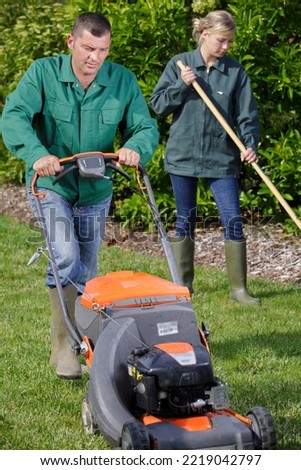 portrait of a gardening team maintaining lawn