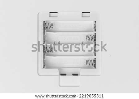 Place to insert AA batteries. Battery compartment. Battery holder. Royalty-Free Stock Photo #2219055311