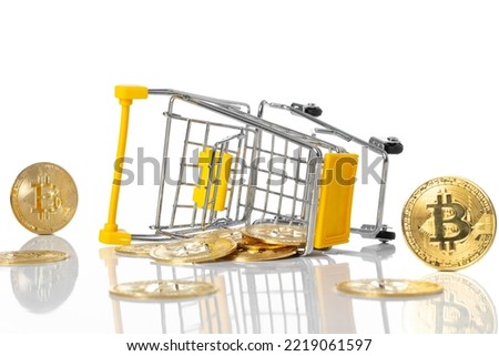 Full of gold bitcoins cryptocurrency in shopping cart fell down- virtual cryptocurrency concept- isolated on white background.