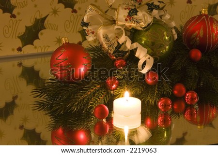 A traditional christmas decoration, christmas ball with christmas bow tied to it, pine branch, copy space