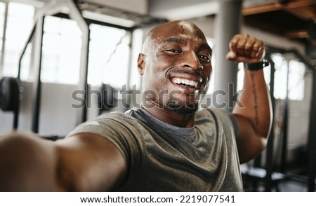 man, strong and fitness selfie, gym and exercise portrait, after workout and weight training, happy and flexing arm. Cardio, endurance and smile, sweat for sport and bicep photo, wellness. Royalty-Free Stock Photo #2219077541