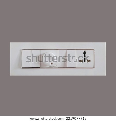 Modular Switches for home stock images.white electricity switch and socket board isolated.Best Electrical Switch images for Modern home walls.GM, Lagrange  Royalty-Free Stock Photo #2219077915