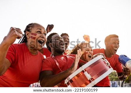 African football fans having fun cheering their favorite team - Soccer sport entertainment concept Royalty-Free Stock Photo #2219100199