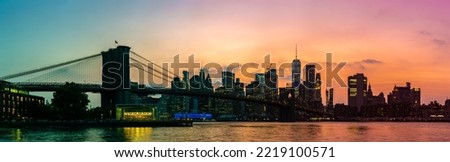 Panorama of  Sunset view of Brooklyn Bridge and panoramic view of downtown Manhattan in New York City, USA