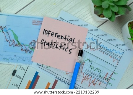 Concept of Inferential statistics write on sticky notes with statistics isolated on Wooden Table. Selective focus on Inferential statistics text