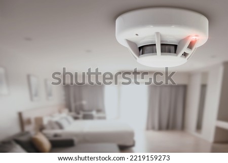 smoke detector fire alarm detector home safety device setup at home hotel room ceiling Royalty-Free Stock Photo #2219159273