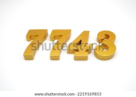   Number 7743 is made of gold-painted teak, 1 centimeter thick, placed on a white background to visualize it in 3D.                                
