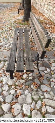 mobile photo of wood bench in the park