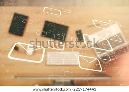 Creative abstract postal envelopes sketch on modern laptop background, e-mail and marketing concept. Double exposure