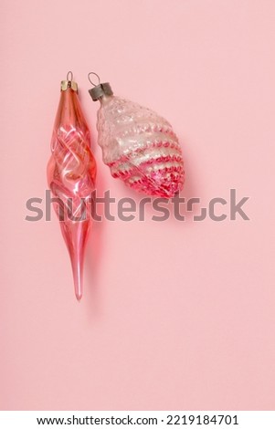 vintage glass christmas toys on pink background