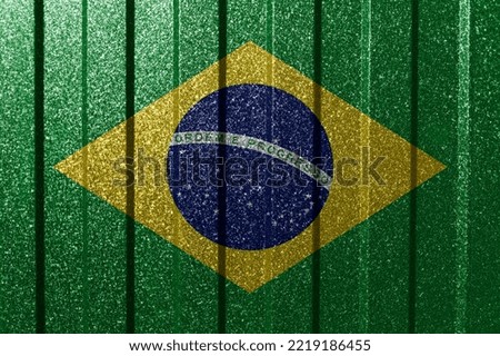 Textured flag of Brazil on metal wall. Colorful natural abstract geometric background with lines.