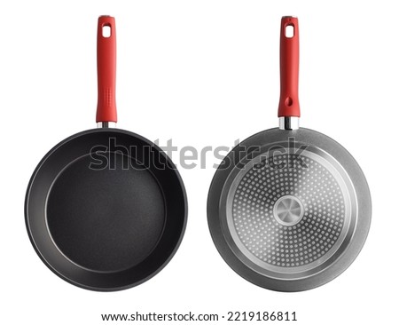 A frying pan with a red handle on a white background. Front side and back. isolated object. top view Royalty-Free Stock Photo #2219186811
