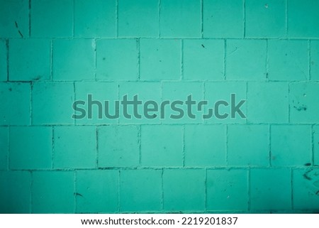 Close-up of green wall background. Premium green abstract background with dynamic shadow on background, consisting of squares, gradient color, artistic texture, epic background