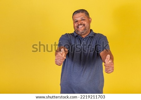 Brazilian black man, adult smiling, forward like sign