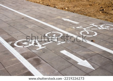 Marking of the bike path on the sidewalk close up