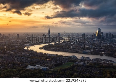 High panoramic view of the urban London skyline during a autumn sunset with clouds and moody light 