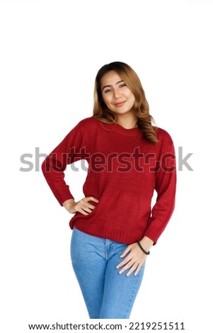 Excited confident asian happy woman in winter sweater red color isolated on white background. Looking at camera