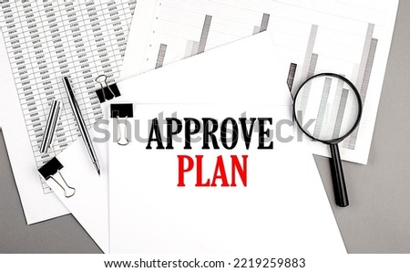 APPROVE PLAN text on a paper on chart background
