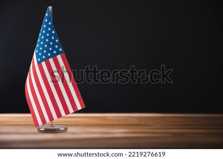 Table American flag on the background of the room
