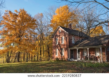 Sunrise lights up the Chellberg homestead in autumn in the Indiana Dunes SP. Royalty-Free Stock Photo #2219280837